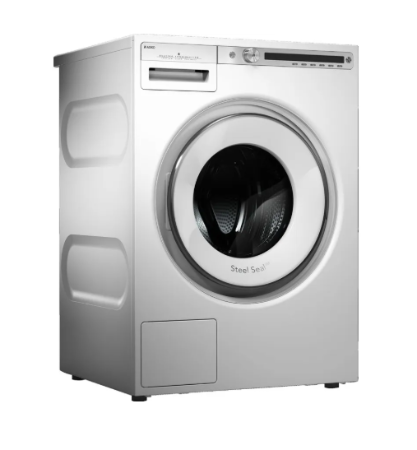 A front-loading washing machine in a metallic silver finish, featuring a large circular door with a clear window and the 'Steel Seal' branding, set against a plain white background.